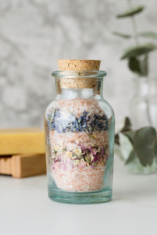 Cork bottle with colorful homemade bathsalts