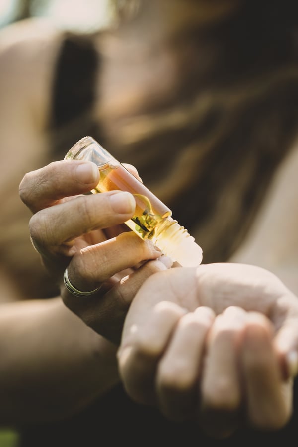 Applying a perfume on the wrist 