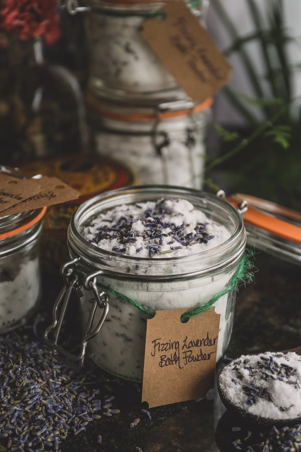DIY fizzing lavender bath powder in a labeled gift jar