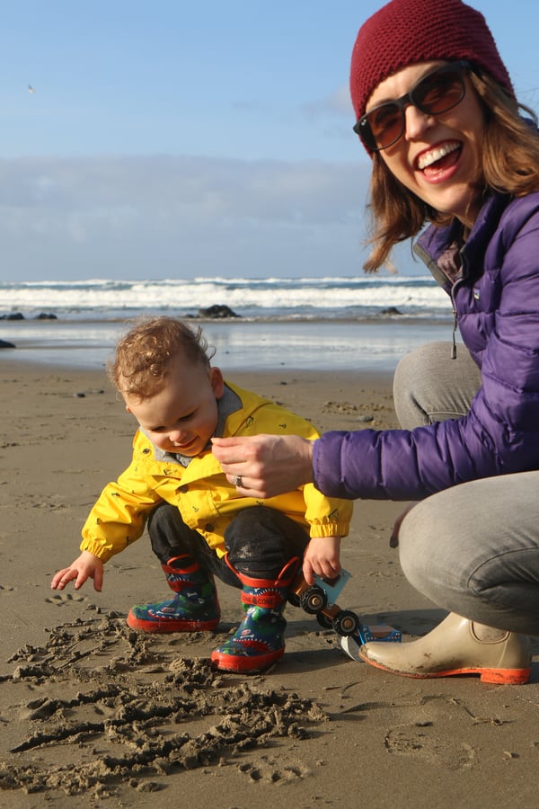 Fun day at the beach with mother and child.