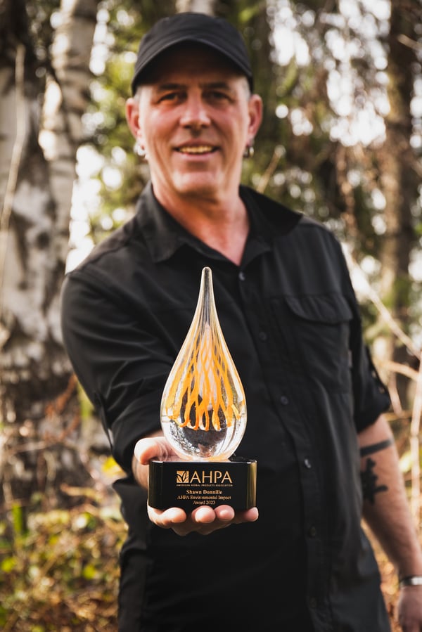 Shawn stands proudly with his AHPA award