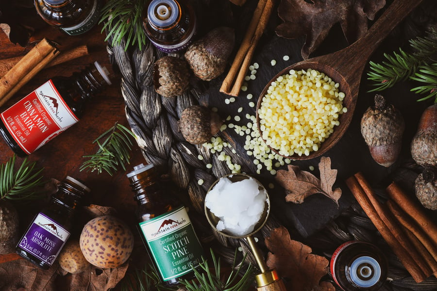 Ingredients for acorn spice candles laying out on table top