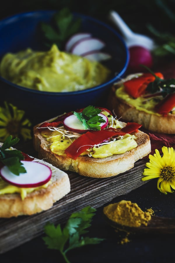 Homemade aioli on bruschetta with vegetables.