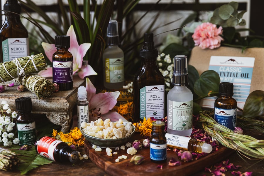 An assortment of Mountain Rose Herbs aromatherapy products on counter top