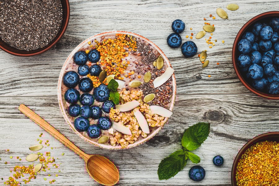 An over head photo of a smoothie bowl with bee pollen on top