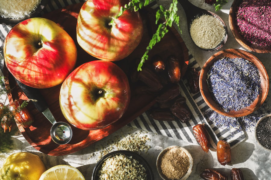 Ingredients for caramel apple bites sit out on a counter top in the sunshine