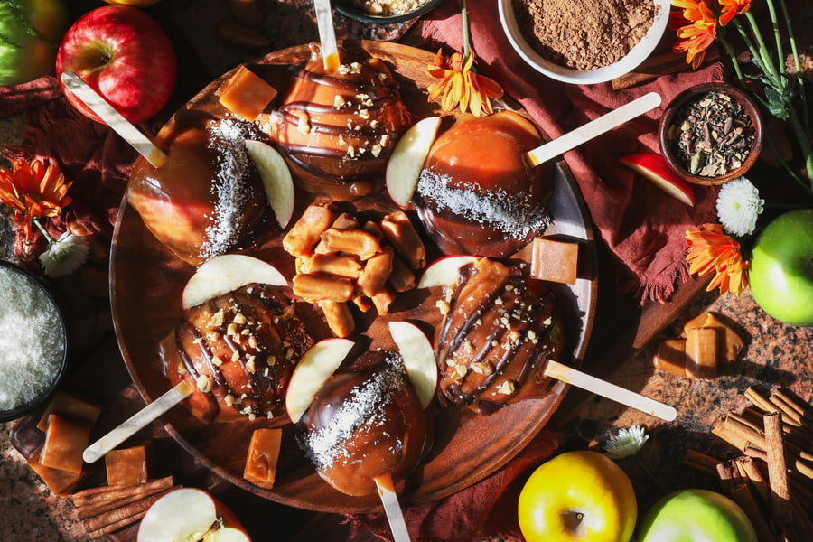 Caramel apples lay out on a plate