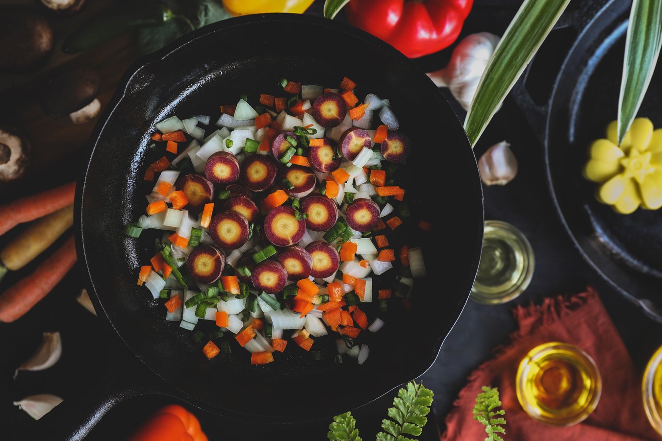 Chopped vegetables in a cast iron skillet