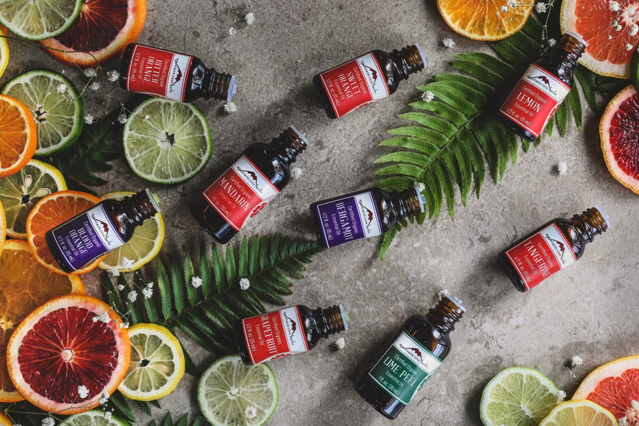 An array of citrus essential oils lays out