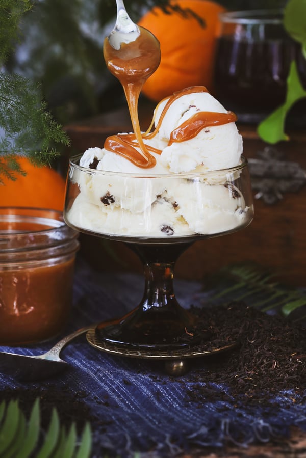 Earl grey caramel sauce is drizzled over ice cream