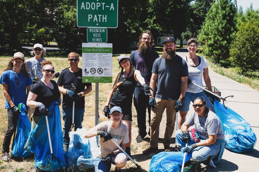 Employees enjoying a bike path clean up