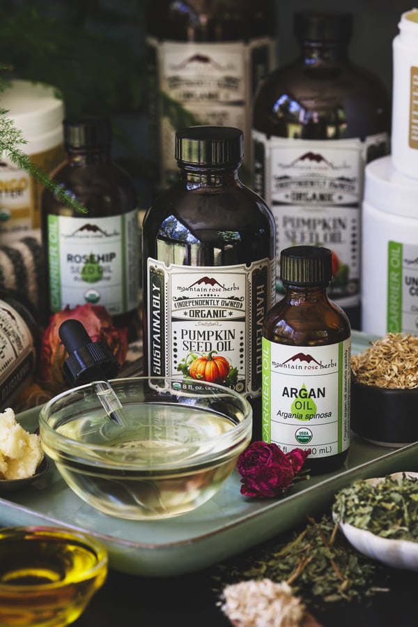An assortment of hair care products meant for various porosity types