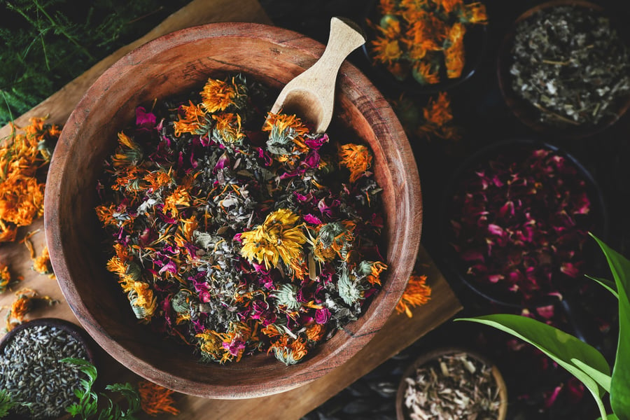 A blend of herbs for facial steam sit in a bowl