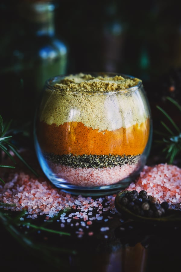 Cup layered with salt and colorful powdered herbs