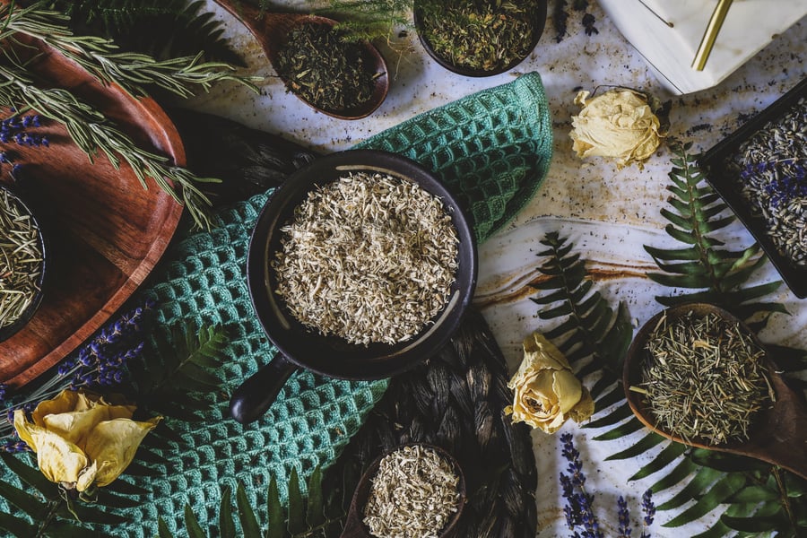 Herbs for natural hair care lay out on a counter top