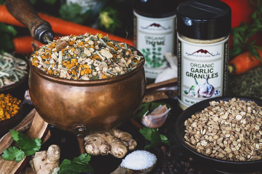 A bowl of immune supporting herbs to be used in crafting broth