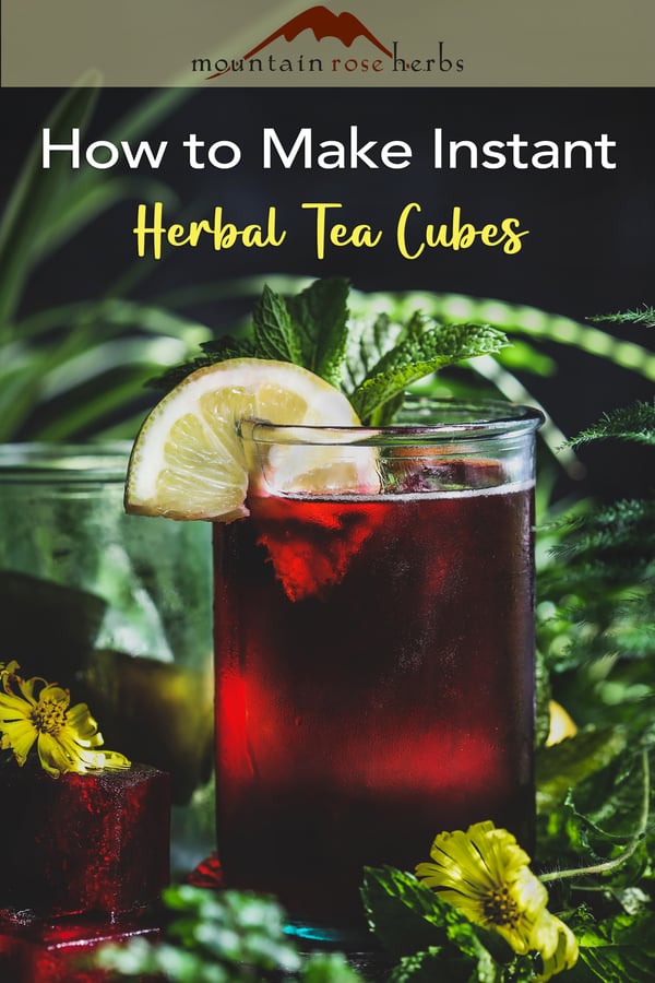 Cup of deep red beverage with fresh mint and lemon