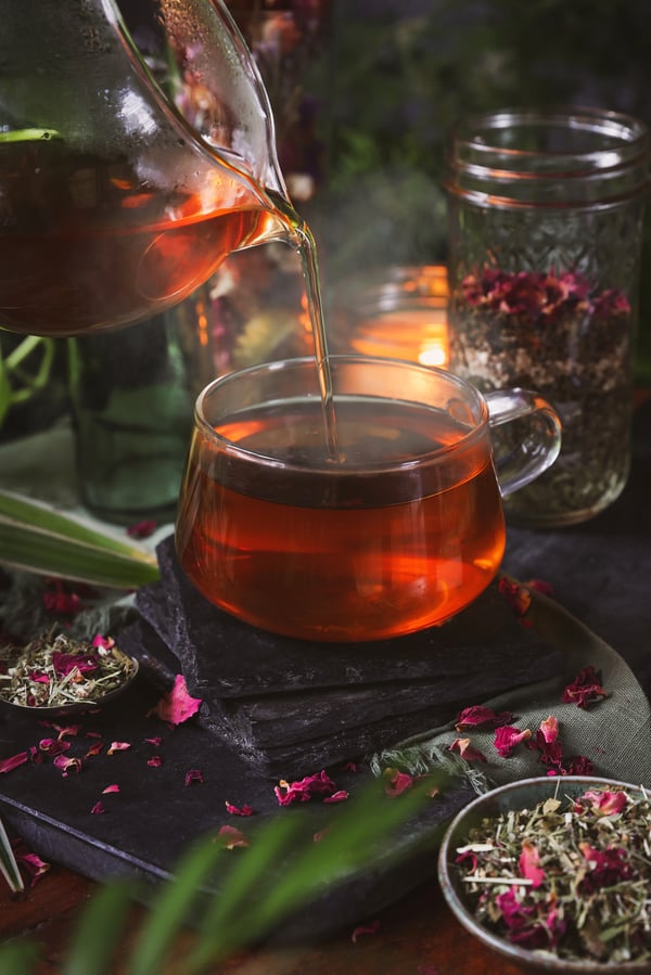 Menstruation tea blend is poured into glass
