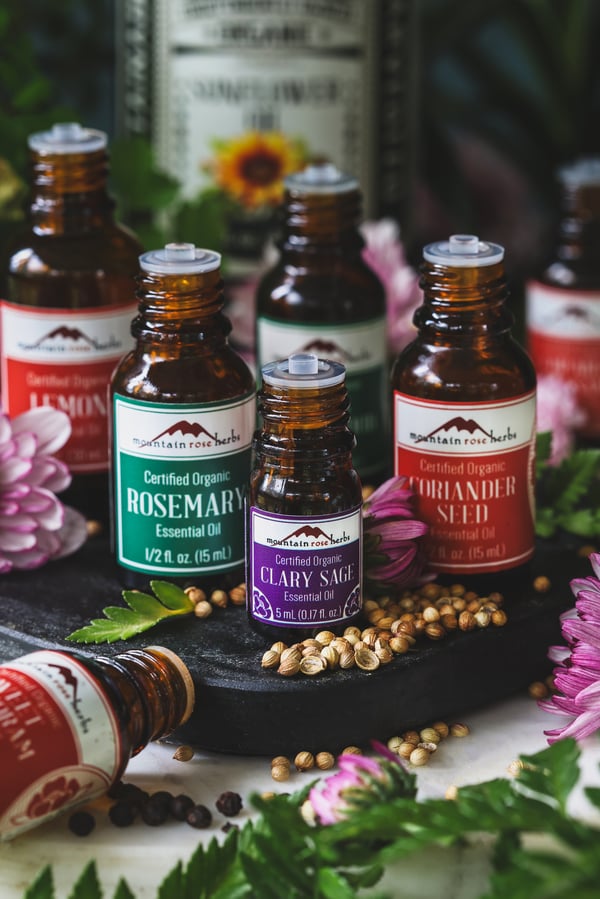 The essential oils used in new moon perfume grouped on counter top