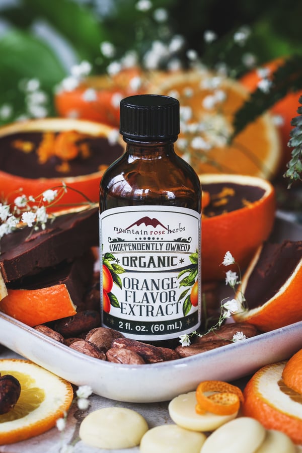 Orange extract with choclate orange cups in the background