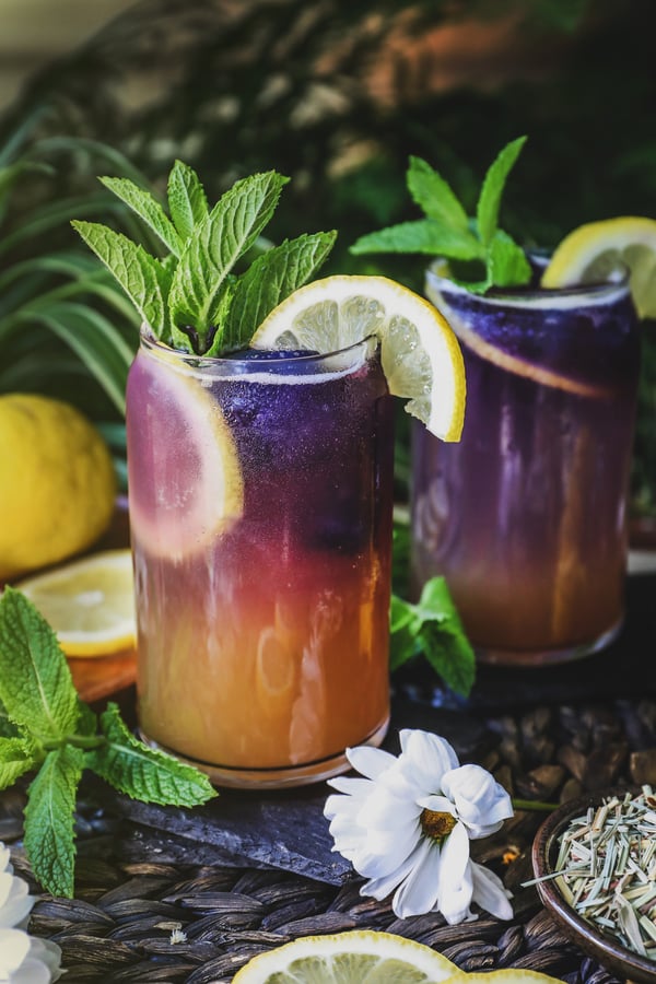 A refreshing oxymel mocktail garnished with lemon and mint
