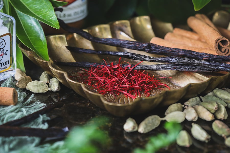 Ingredients for saffron latte sit out on a tray