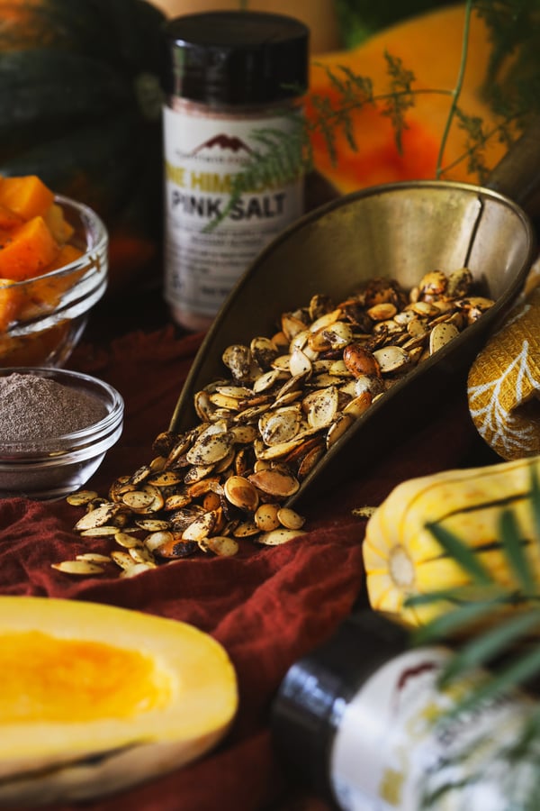 Roasted squash seeds in a scoop