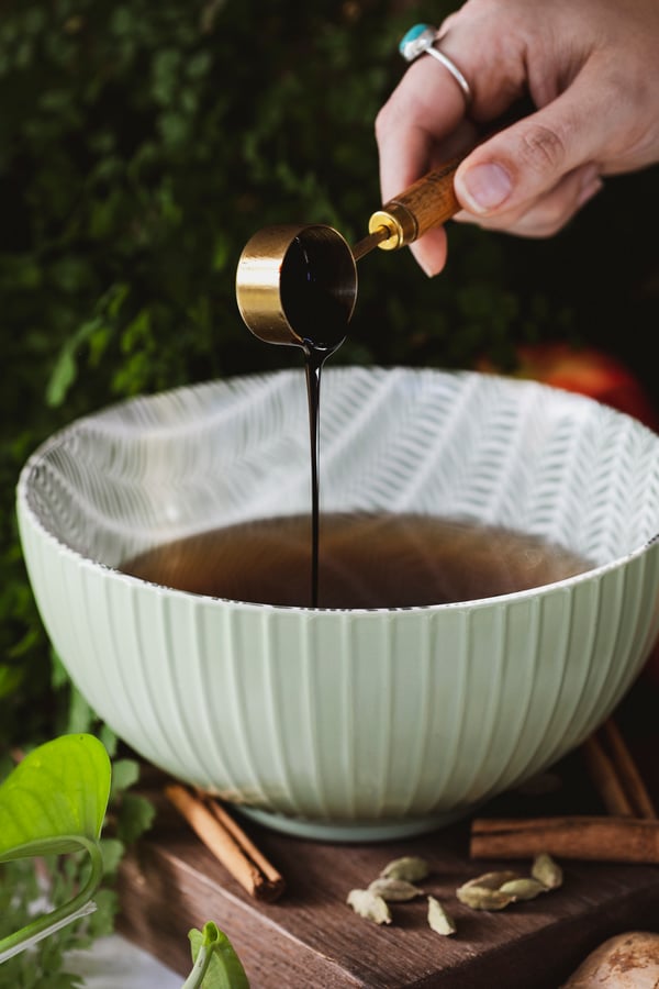 Molasses being poured into a bowl 
