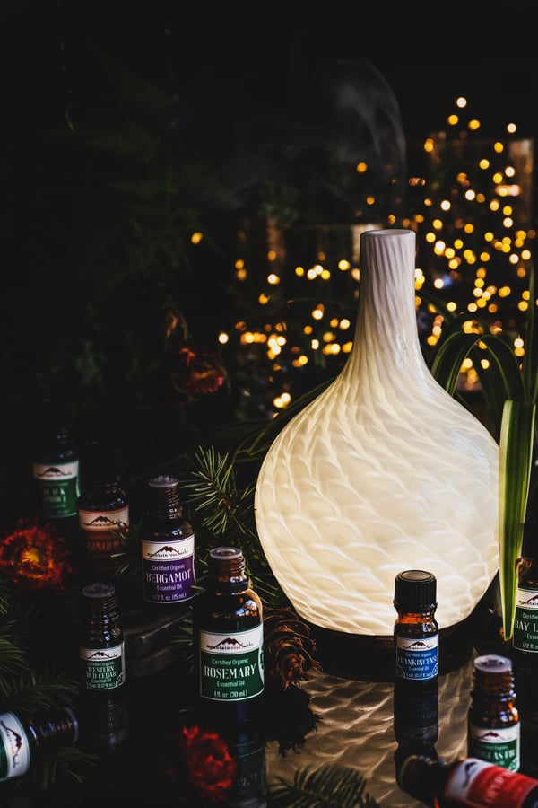 A diffuser steams a delightful blend of essential oils.