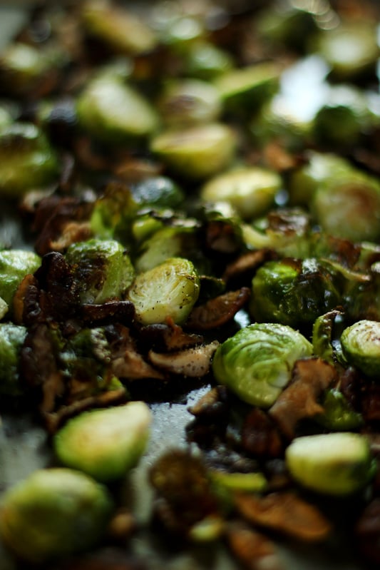 Garlic-infused olive oil gives roasted brussels sprouts a delicious aroma and flavor. Add spices and shiitake mushrooms for a decadent side dish.