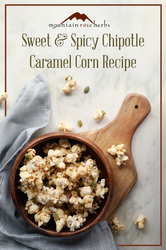 Pinterest link to Mountain Rose Herbs. A bowl of homemade caramel corn with pumpkin seeds, hemp seeds, and pumpkin pie spice. Perfect for fall snacking, sweet and spicy with chipotle powder.