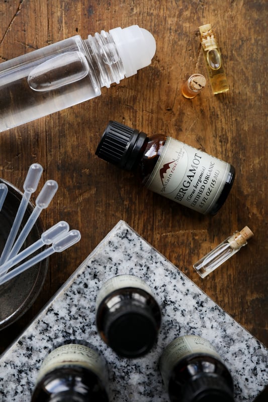 Essential oils can be difficult to blend without a helpful conversion chart. Using a conversion chart allows for accurate amounts of of oils in your blends, like lavender and bergamot oils for use in a roll top bottle.