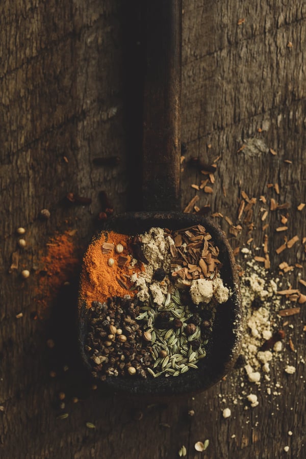 Herbs for an electuary in a wooden spoon