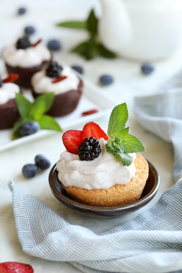 Berry-Bramble-Tea-flavored whipped coconut cream on dessert cakes with berries