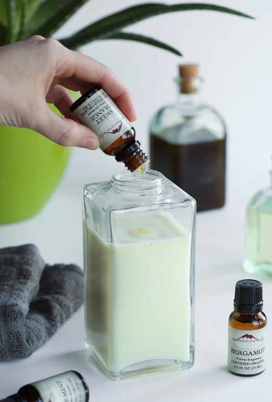 Blending essential oils into an organic avocado oil carrier oil and natural castille liquid soap. Essential oils of bergamot, sweet orange, and spearmint are used to create a natural foaming hand soap. 