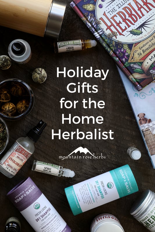 Holiday gifts for the home herbalist include flowering teas, aromatherapy picks like essential oil roll-ons and aroma sprays, body care products like dry herbal shampoo and scrub butters, and books on herbalism.