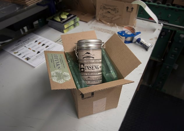 Ginseng container in green sustainable bubble wrap being shipped inside recyclable box