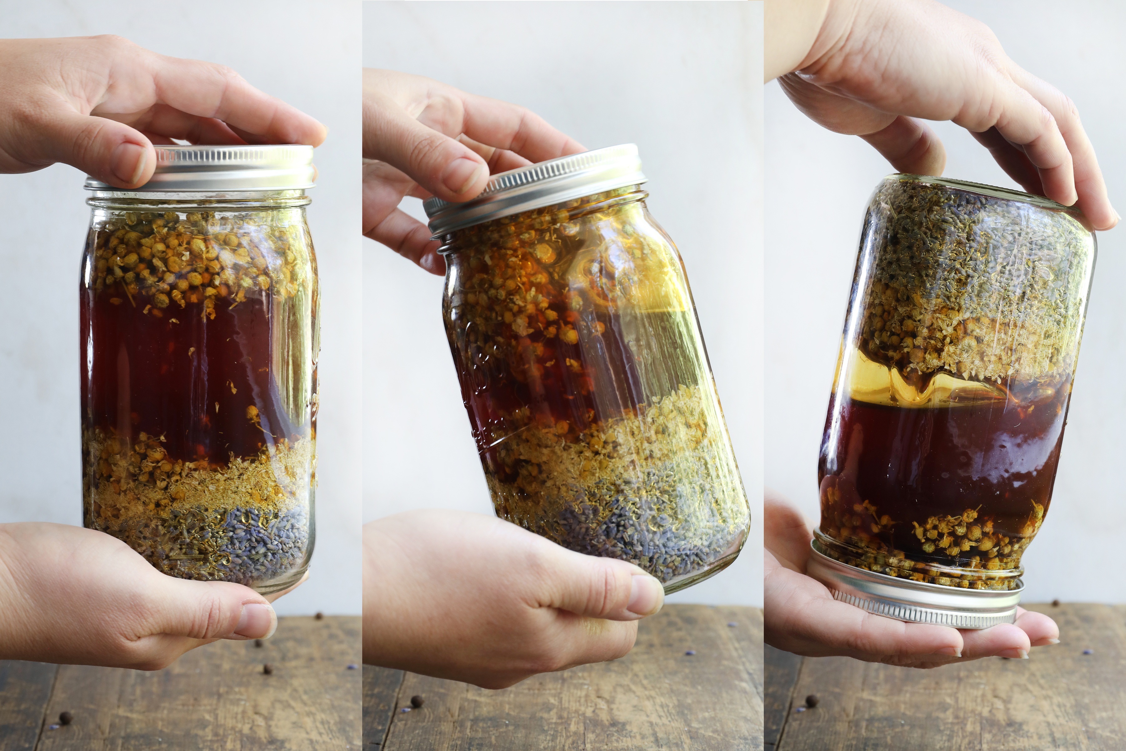 Hands flipping mason jar to mix honey and herbs