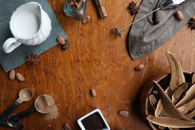 Ingredients for making herbal mushroom hot chocolate on wooden table
