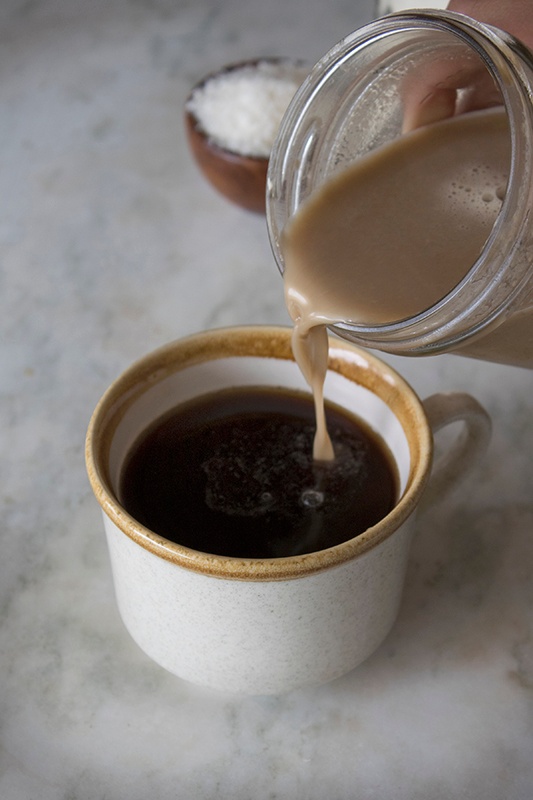 Homemade Creamer Pouring into Cup of Coffee