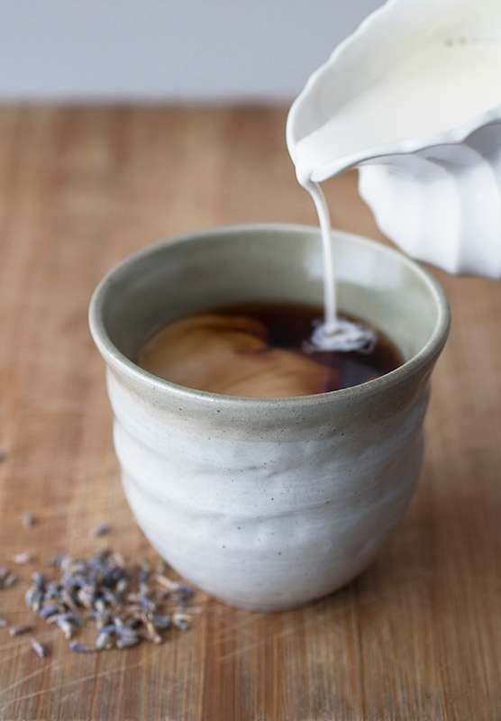 Milk pouring into lavender earl grey latte