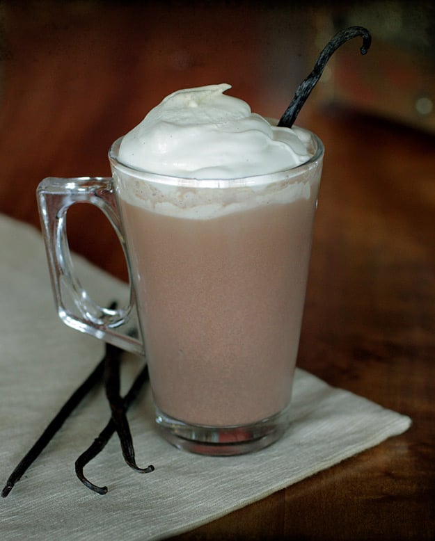 Spiked Vanilla Bean Cocoa in glass mug on tabletop