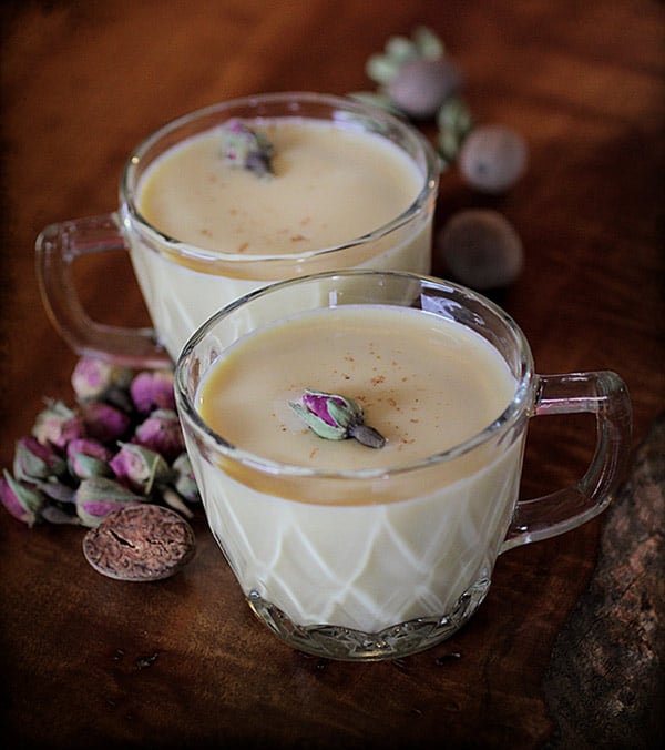 Rose and Cardamom Egg Nog in Antique Glass Mug on Tabletop