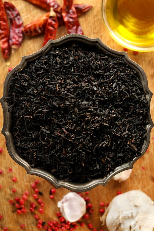 Lapsang souchong is a smoked black tea that can be used in culinary recipes like infused cooking oil or simple syrup. Black tea pairs well with warming, earthy flavors like black pepper, garlic, and chilis. 