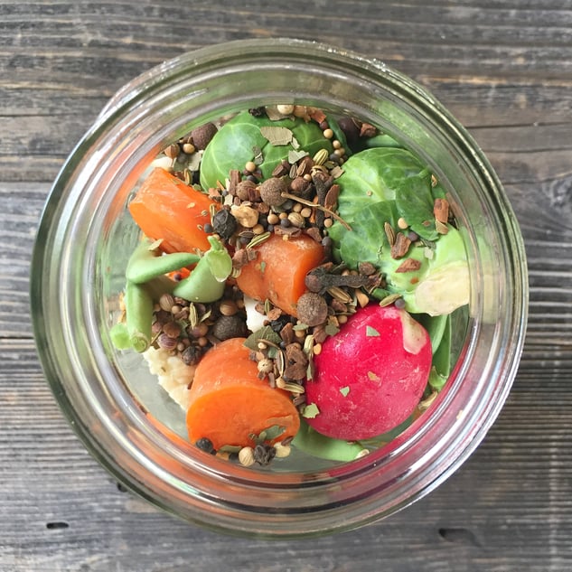 Open mason jar with veggies and pickling spice