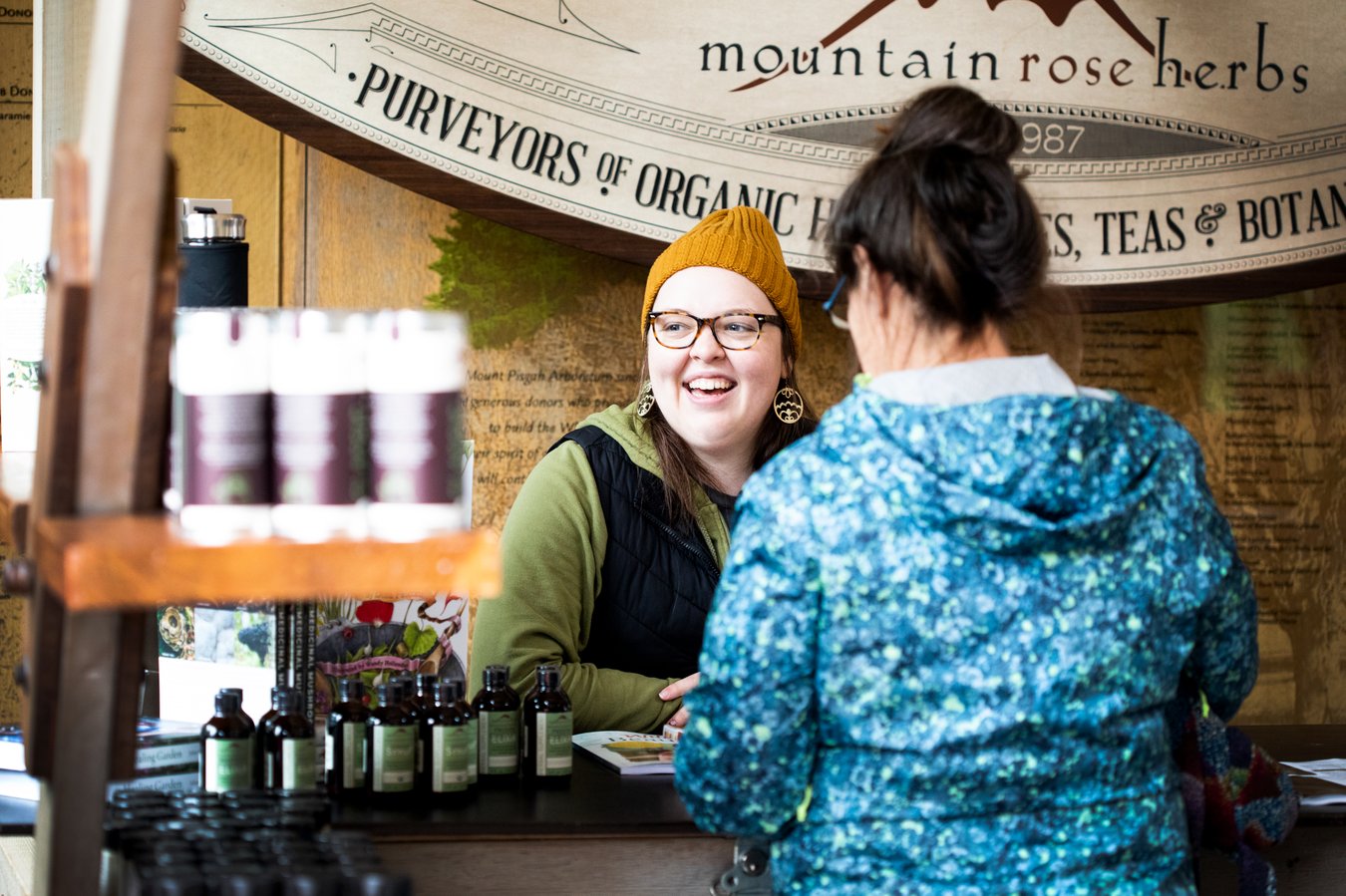 Mountain Rose Herbs staff vend at the Summer Free Herbalism Project in 2022.