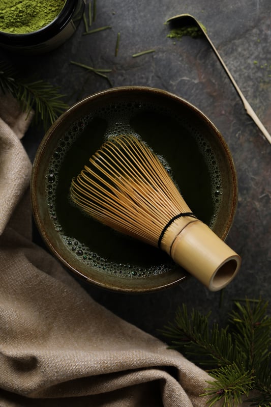 Matcha is prepared by using special tools like a bamboo matcha whisk and bamboo matcha spoon. Traditional matcha is still prepared this way by whisking powdered green tea leaves into a frothy green beverage.