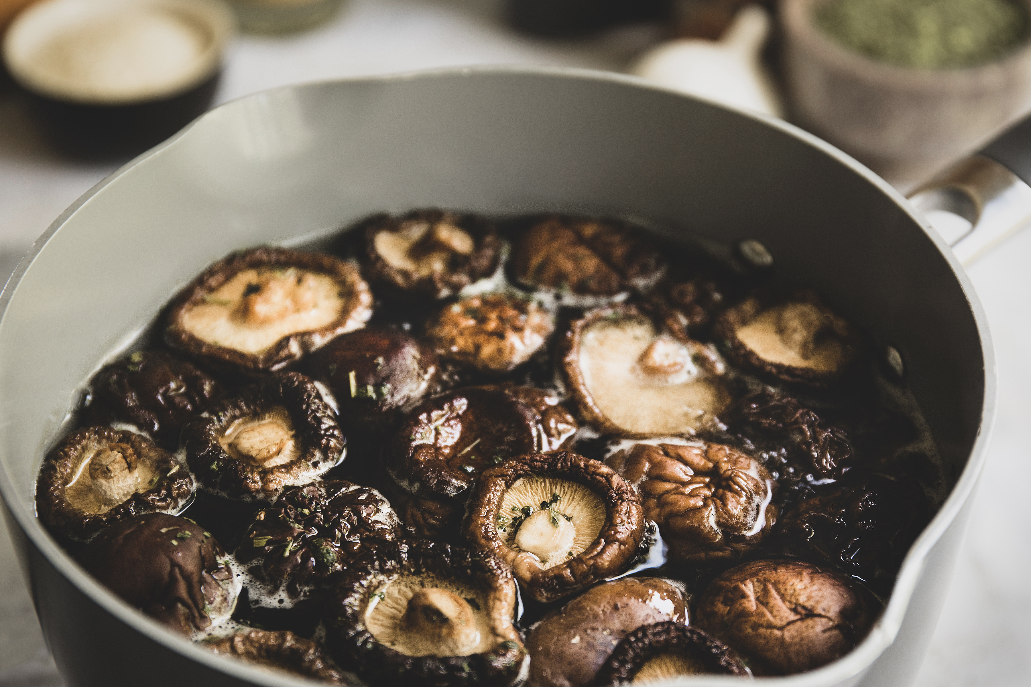 Bowl of shiitake mushrooms soaking in water. 