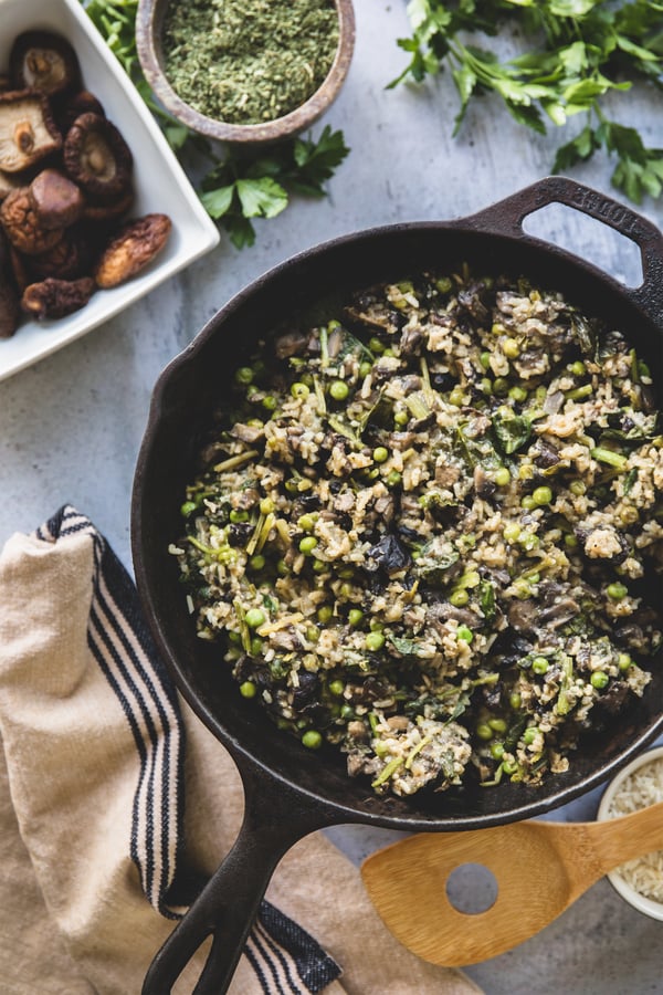 Cast iron pan with risotto dish including peas