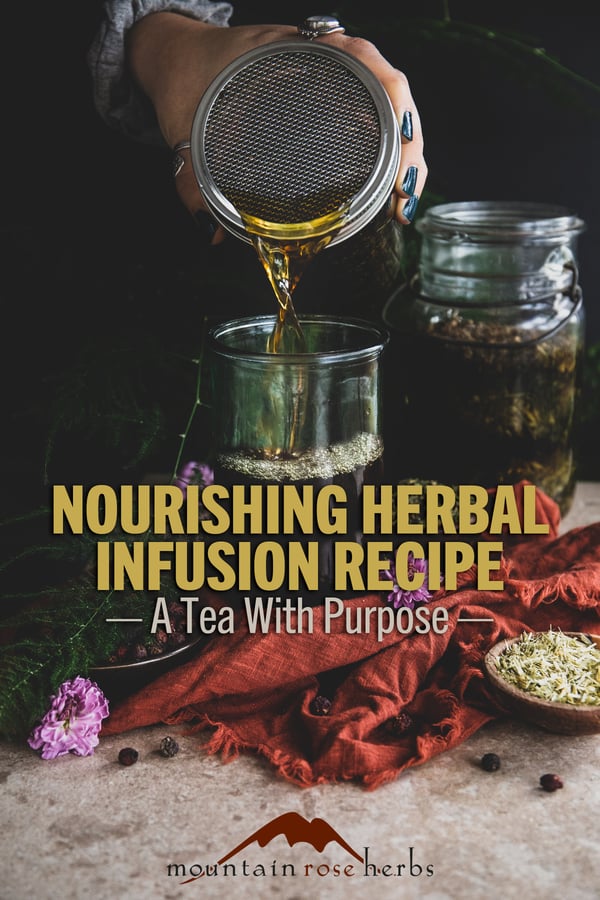 An herbal infusion being poured into a clear glass with the text "Nourishing Herbal Infusion Recipe - A Tea With Purpose"